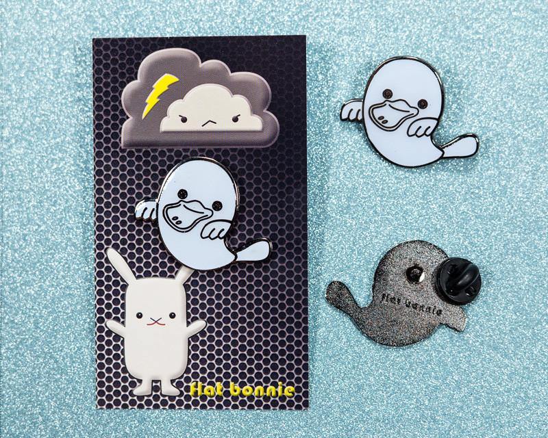 679. "PlatyBoo the Platypus Ghost" - Glow in the Dark Enamel Pin by Flat Bonnie (Yukari Fujimoto) - Hero Complex Gallery